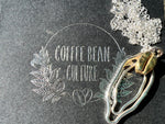 Sterling silver vulva necklace with brass coffee bean