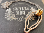 Sterling silver vulva necklace with brass coffee bean